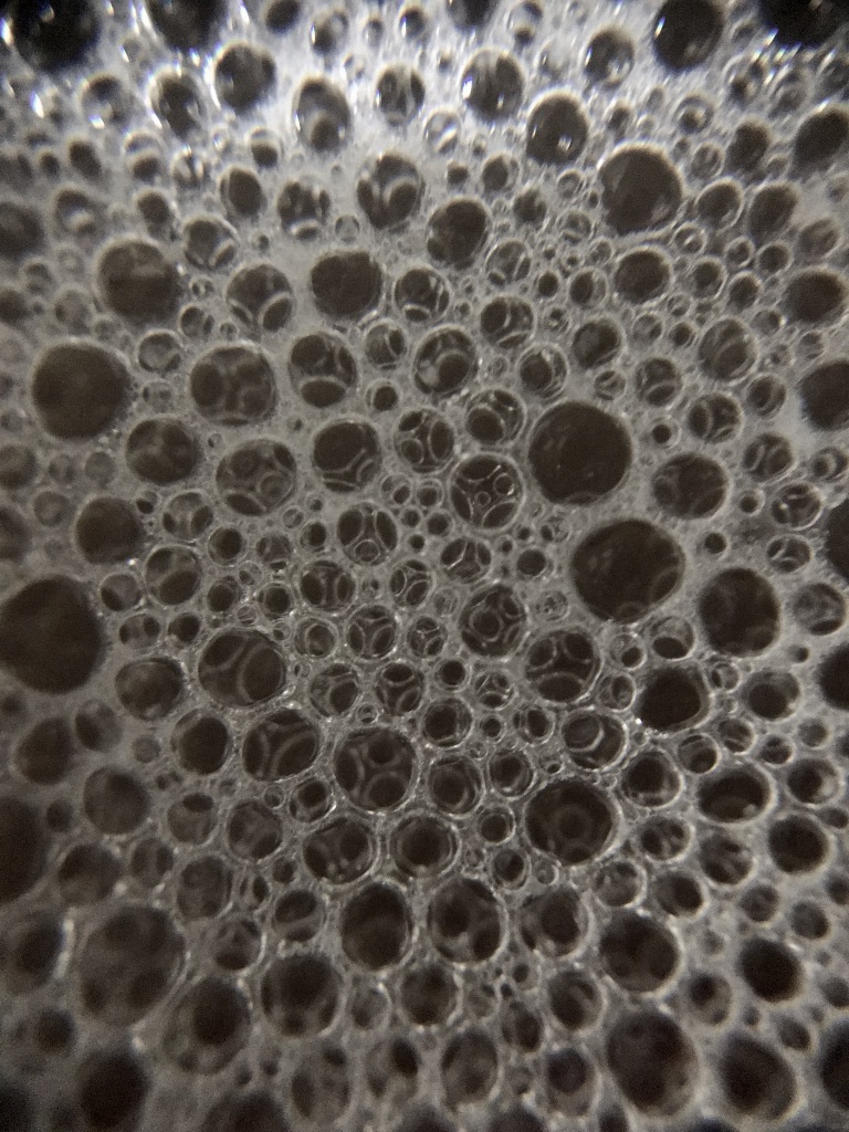 Close up photograph of soap bubbles.