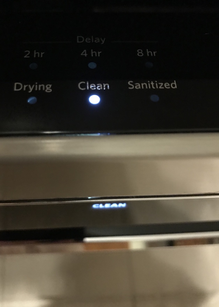 Close up of light clean button on a dishwasher