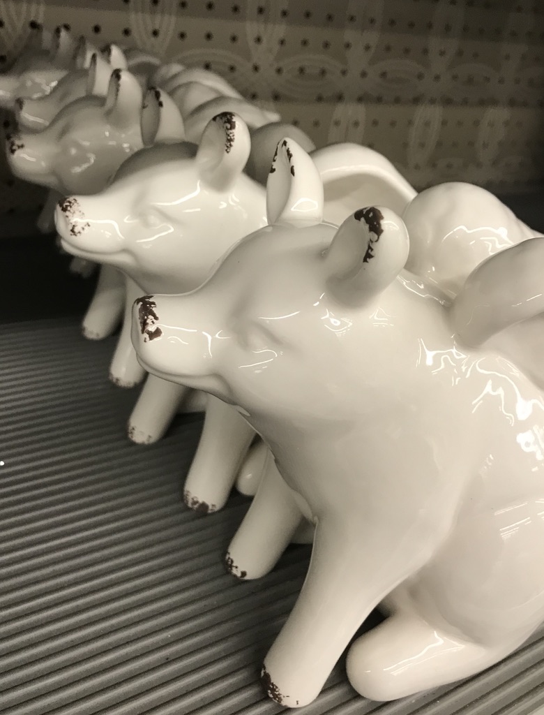 Ceramic white pigs with wings
