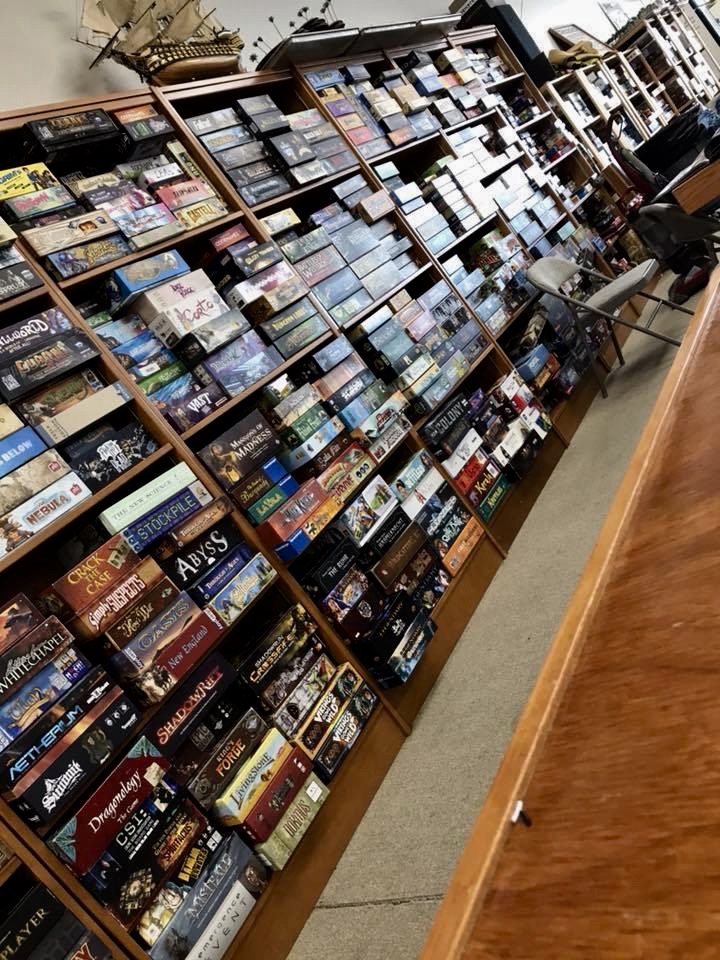 A wall of shelves filled with board games