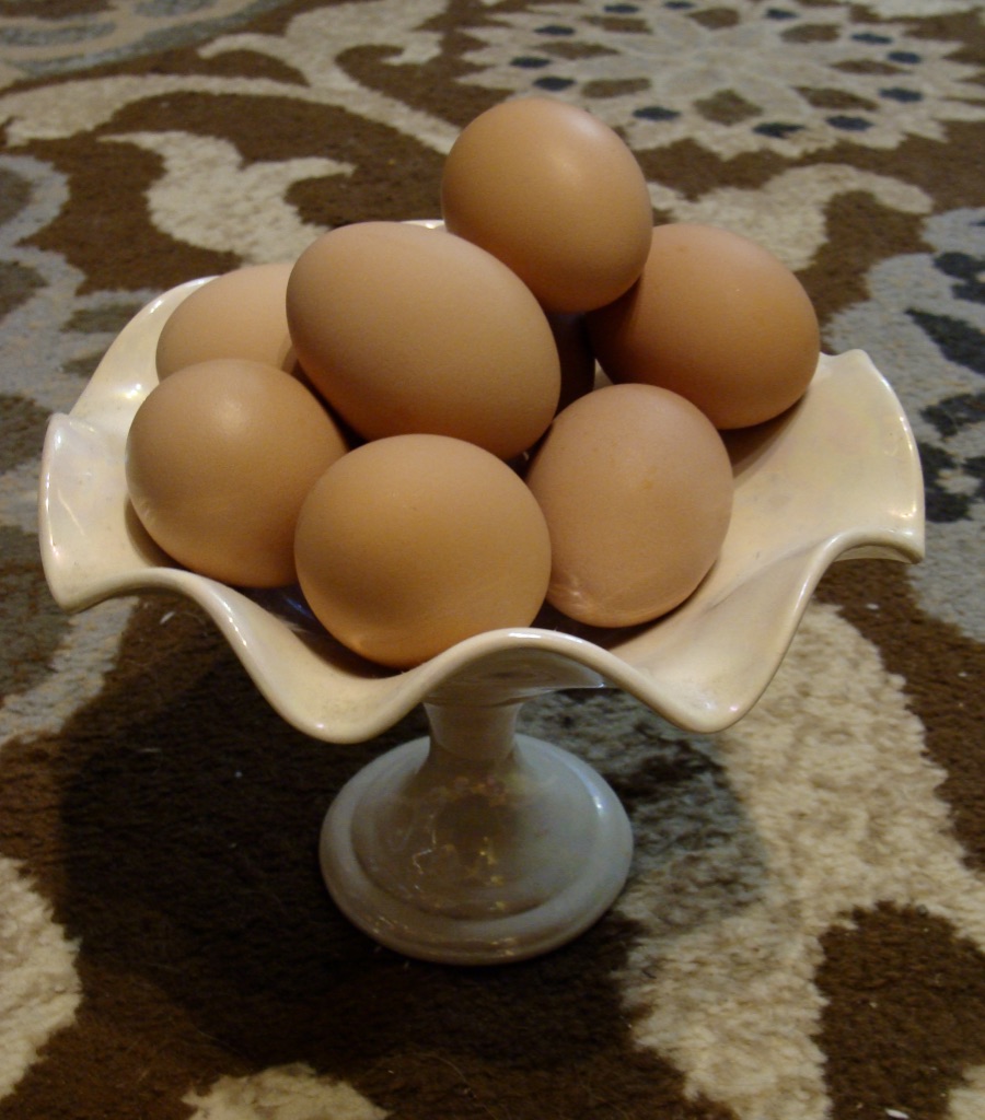 fresh brown eggs stacked in a bowl