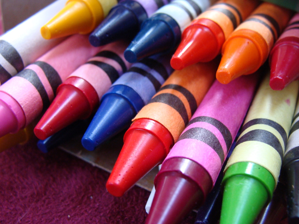 The tops of a box of crayons