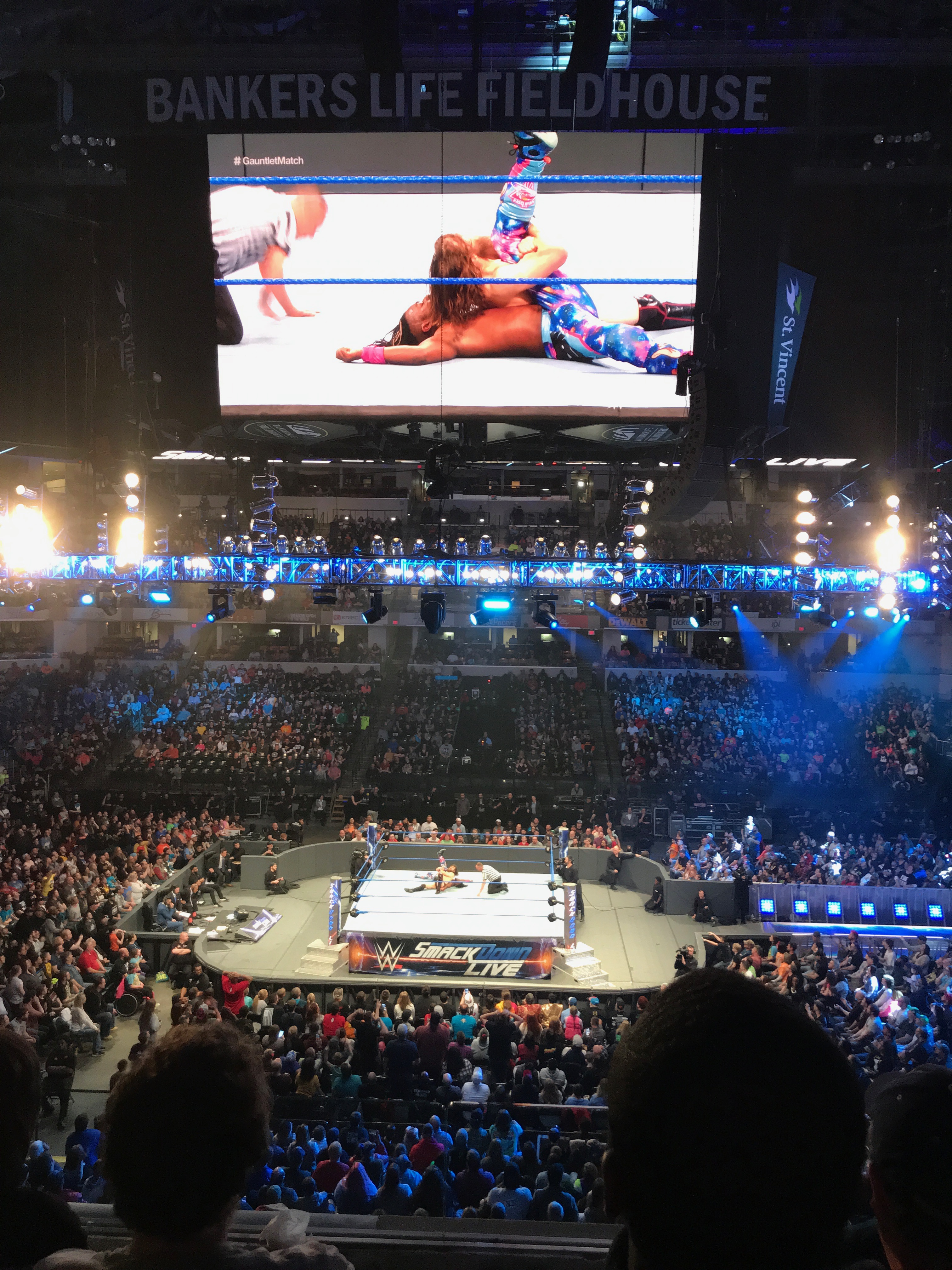 Wrestling match shot from halfway up in stadium.