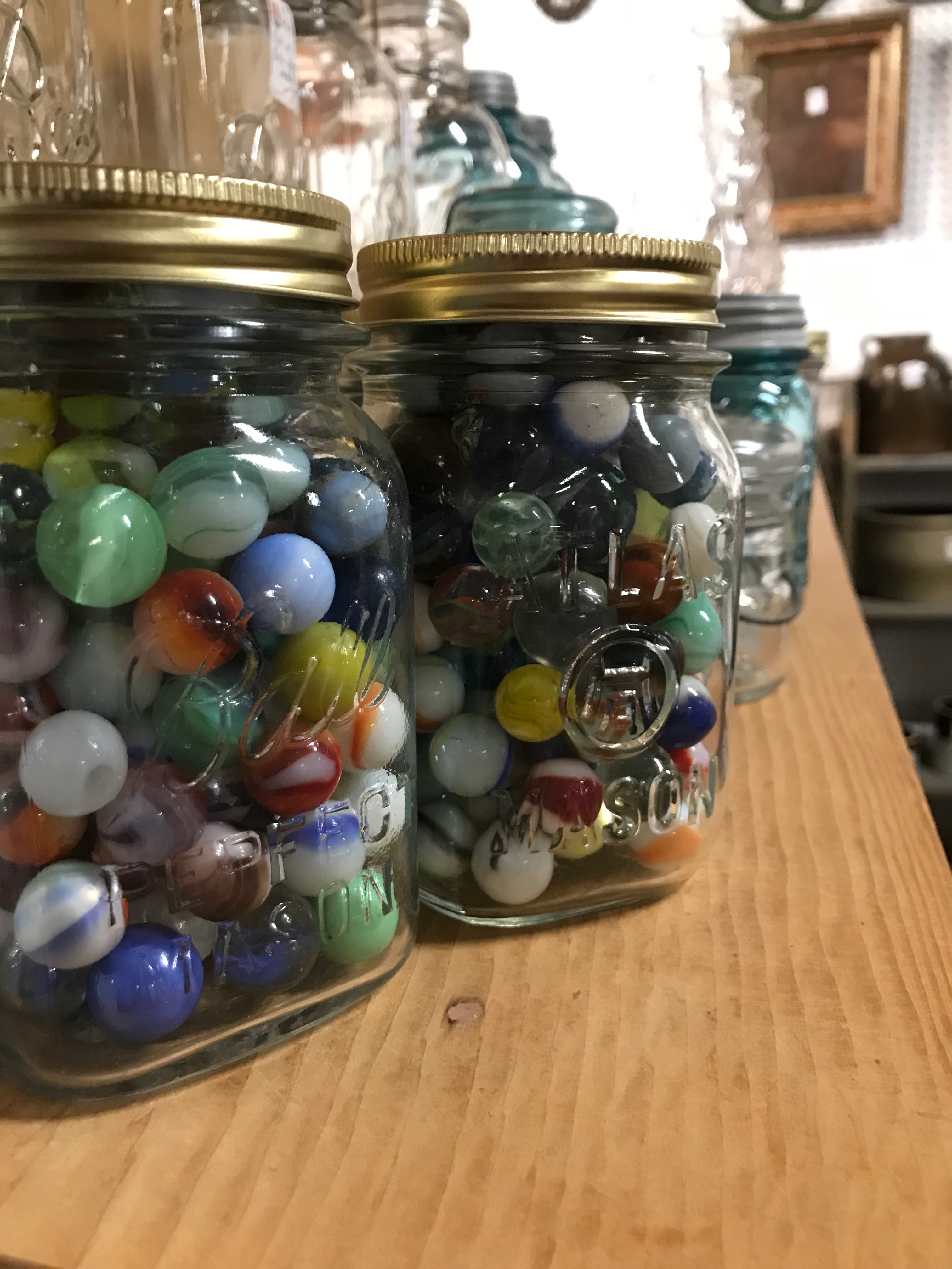Jars of multicolored marbles.