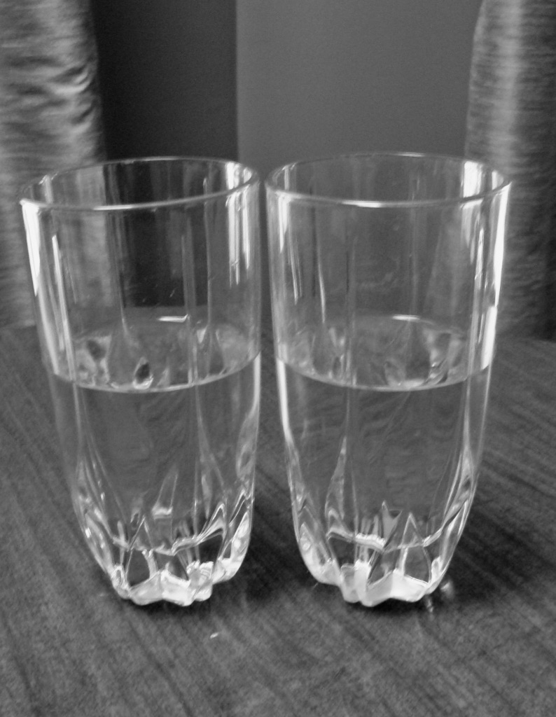 two glass of water both are half full with liquid