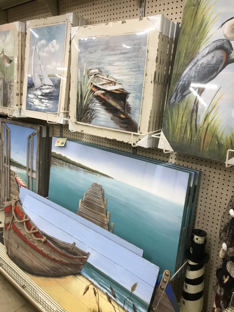 paintings of ocean views and boats