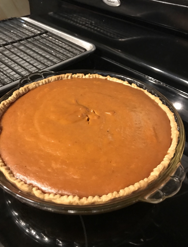 Pumpkin Pie cooling on top of the stove