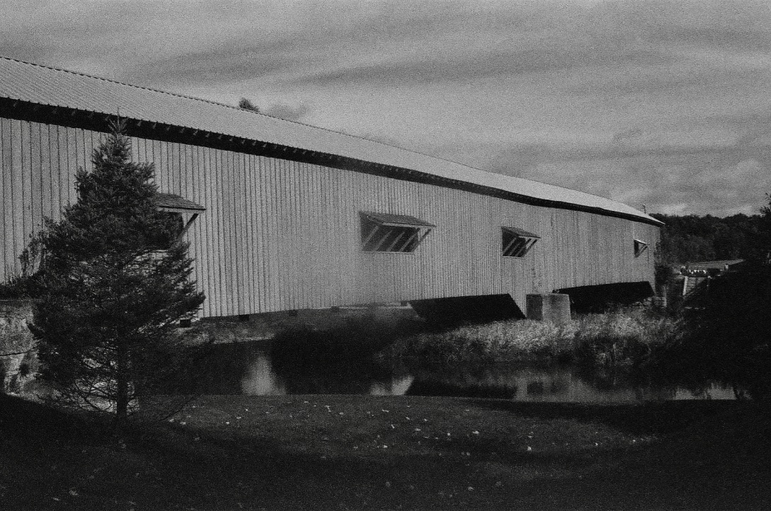 A covered bridge over a river