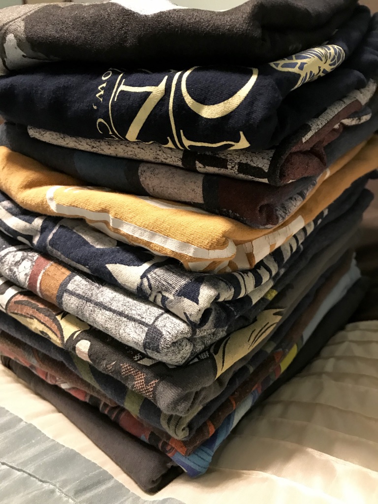 A stack of folded tee shirts