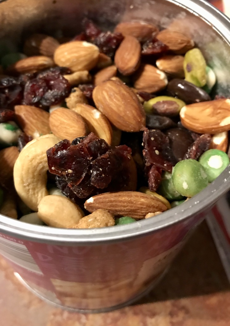 A jar of mixed nut trail mix,