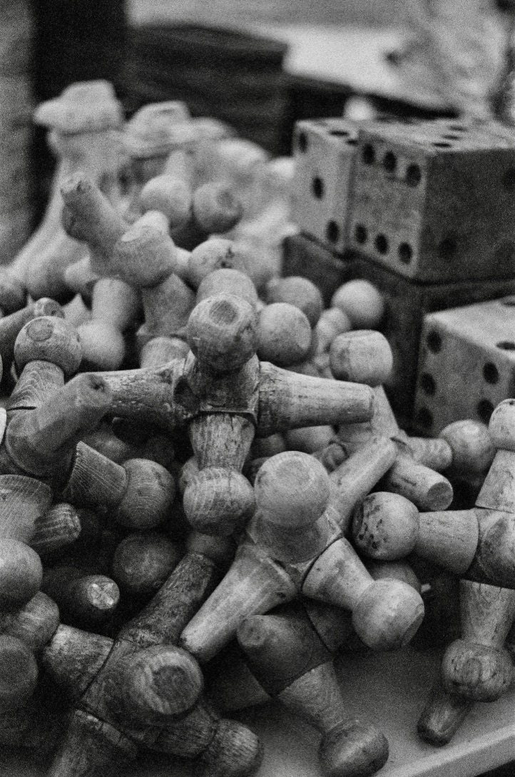 black and white of large wood jacks and dice.