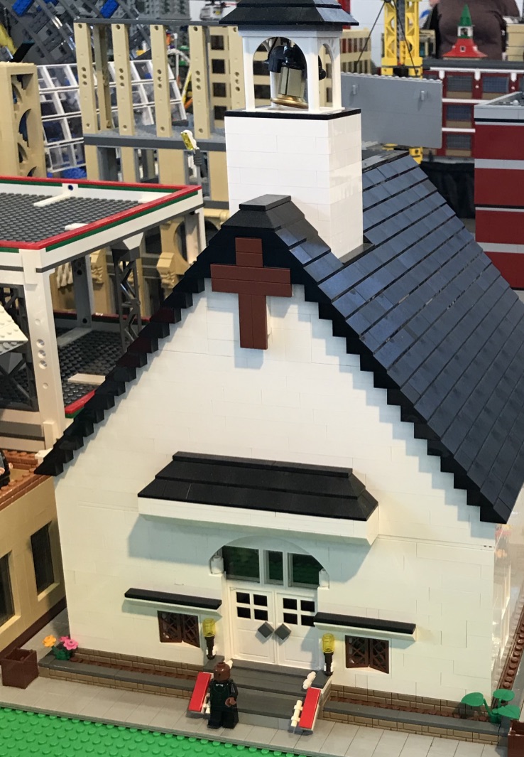 A Lego brick church on a lego street