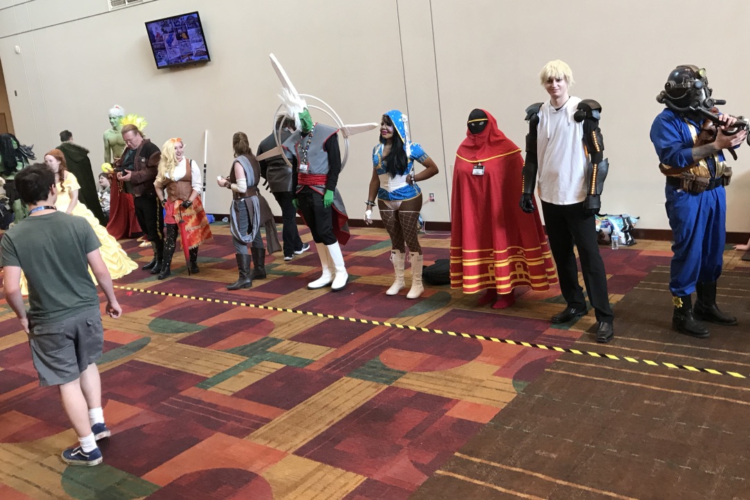 A line of people in different costumes